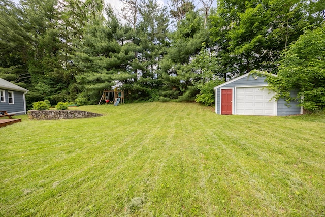 126 Newfield St, Middletown, CT 06457 - view of grassy yard featuring a playground, an outdoor structure, and a detached garage