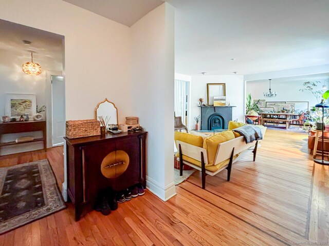 492 Whitney Ave Unit 4B, New Haven, CT 06511 - hall featuring a chandelier, wood finished floors, and baseboards