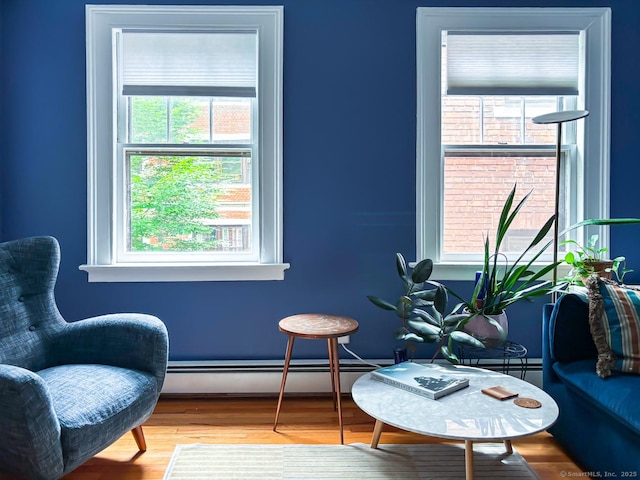 492 Whitney Ave Unit 4B, New Haven, CT 06511 - sitting room featuring plenty of natural light, a baseboard radiator, and wood finished floors