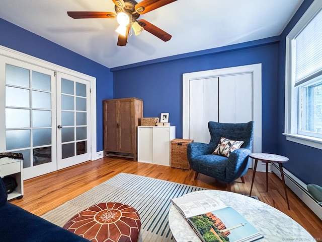 492 Whitney Ave Unit 4B, New Haven, CT 06511 - sitting room featuring french doors, a baseboard radiator, wood finished floors, and ceiling fan