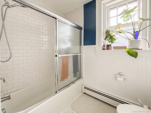 492 Whitney Ave Unit 4B, New Haven, CT 06511 - full bath with a baseboard radiator, a wainscoted wall, toilet, combined bath / shower with glass door, and tile patterned flooring