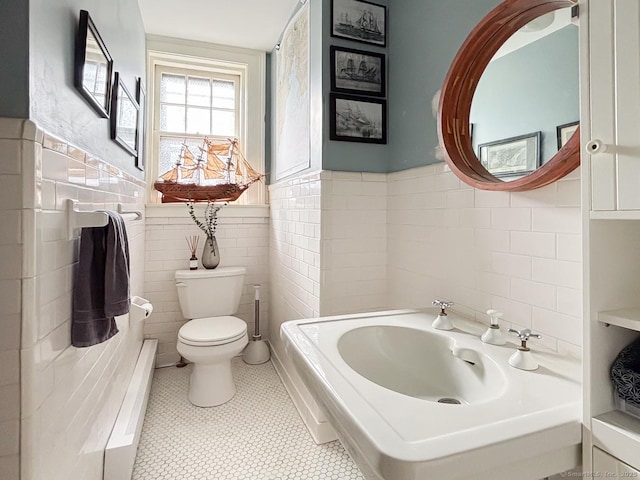 492 Whitney Ave Unit 4B, New Haven, CT 06511 - bathroom featuring tile walls, toilet, and a wainscoted wall