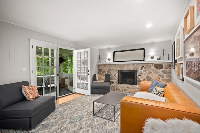 68 Blue Spruce Cir, Weston, CT 06883 - living area featuring wood finished floors, a stone fireplace, and crown molding