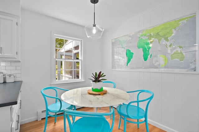 68 Blue Spruce Cir, Weston, CT 06883 - dining space featuring light wood-type flooring, baseboards, and a baseboard heating unit