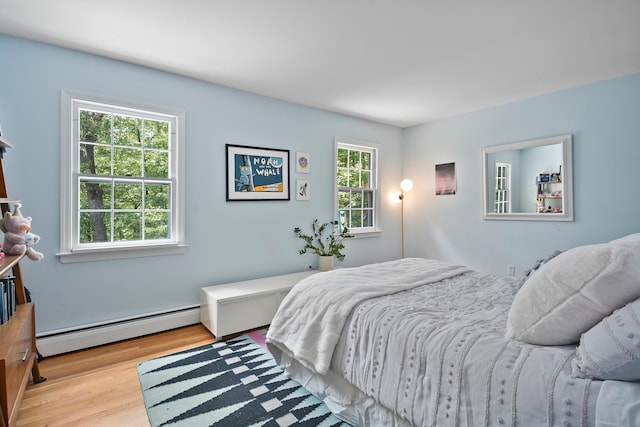 68 Blue Spruce Cir, Weston, CT 06883 - bedroom with baseboard heating and wood finished floors