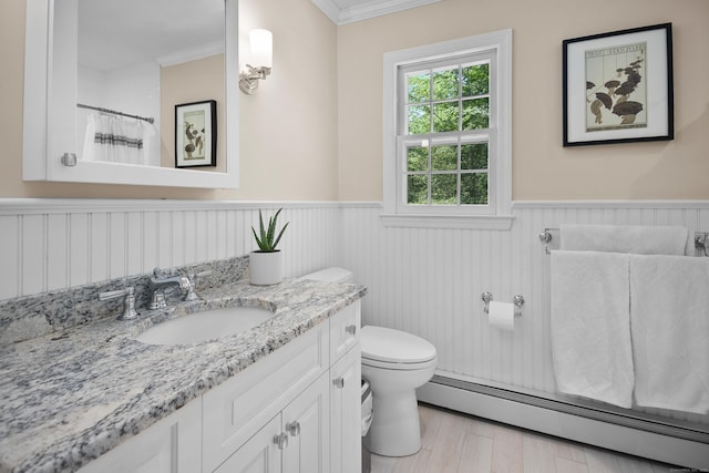68 Blue Spruce Cir, Weston, CT 06883 - full bathroom featuring a baseboard radiator, wainscoting, vanity, toilet, and ornamental molding