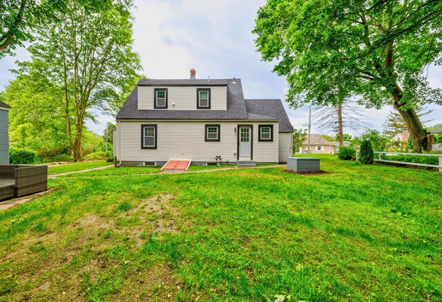 8 Wild Rose Pl, Waterford, CT 06385 - rear view of house featuring a yard, a chimney, and entry steps