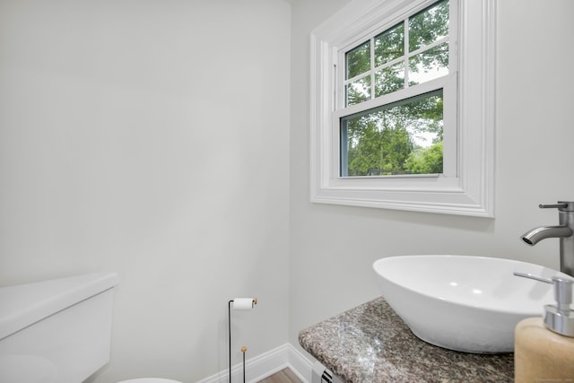 8 Wild Rose Pl, Waterford, CT 06385 - half bath with a sink, toilet, and baseboards