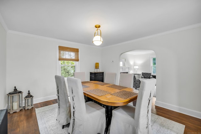 8 Wild Rose Pl, Waterford, CT 06385 - dining area with arched walkways, crown molding, baseboards, and wood finished floors