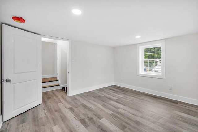 8 Wild Rose Pl, Waterford, CT 06385 - unfurnished bedroom with light wood-style floors, recessed lighting, and baseboards