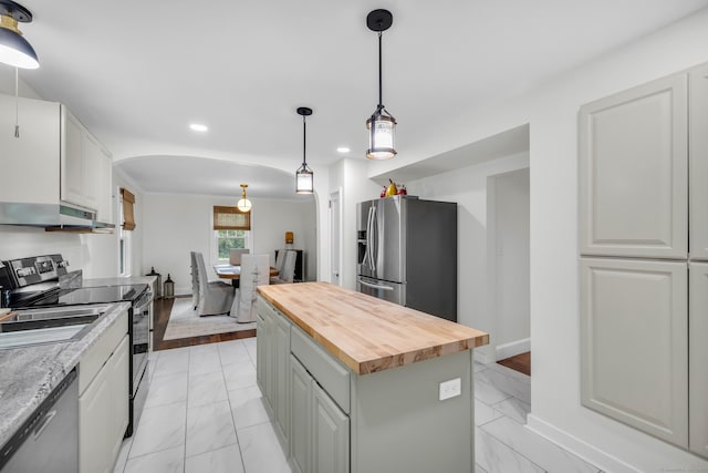 8 Wild Rose Pl, Waterford, CT 06385 - kitchen with appliances with stainless steel finishes, butcher block countertops, under cabinet range hood, light marble finish floors, and recessed lighting