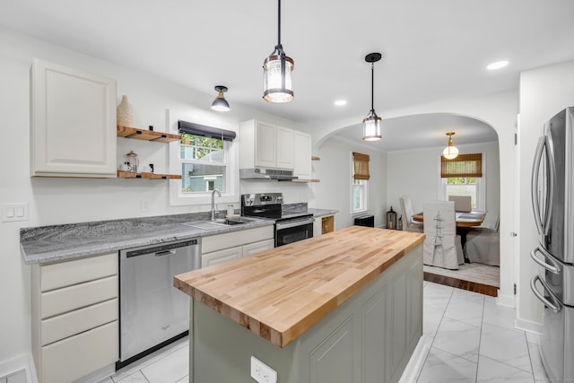 8 Wild Rose Pl, Waterford, CT 06385 - kitchen featuring appliances with stainless steel finishes, butcher block counters, arched walkways, and recessed lighting