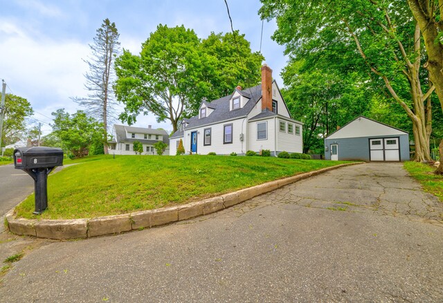 8 Wild Rose Pl, Waterford, CT 06385 - cape cod home featuring an outbuilding, a front lawn, a garage, a chimney, and driveway