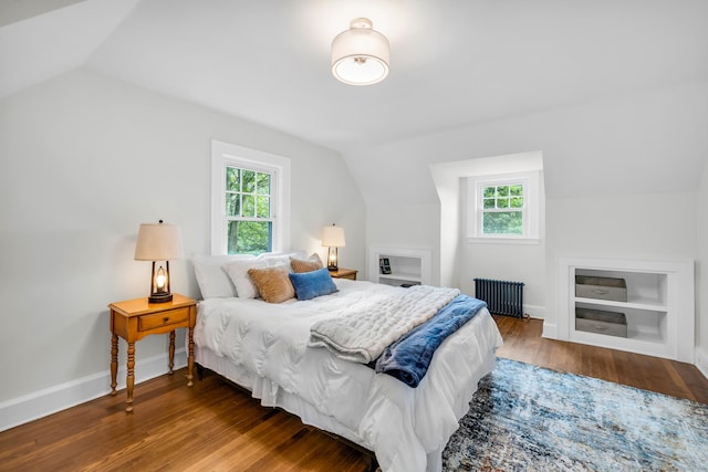 8 Wild Rose Pl, Waterford, CT 06385 - bedroom featuring radiator heating unit, vaulted ceiling, multiple windows, wood finished floors, and baseboards