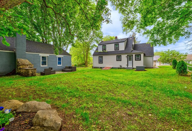 8 Wild Rose Pl, Waterford, CT 06385 - back of property featuring outdoor lounge area and a yard