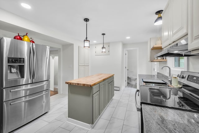 8 Wild Rose Pl, Waterford, CT 06385 - kitchen with appliances with stainless steel finishes, butcher block countertops, under cabinet range hood, a sink, and recessed lighting