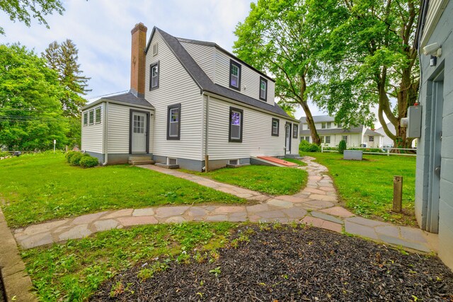 8 Wild Rose Pl, Waterford, CT 06385 - view of property exterior featuring entry steps, a chimney, a lawn, and a shingled roof