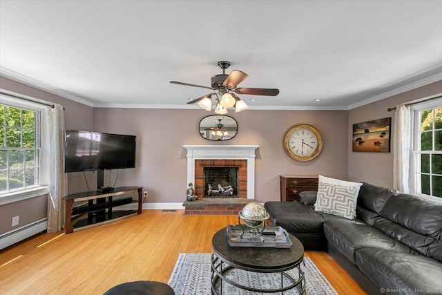 452 Burnt Plains Rd, Milford, CT 06461 - living area featuring wood finished floors, ceiling fan, baseboards, a fireplace, and crown molding