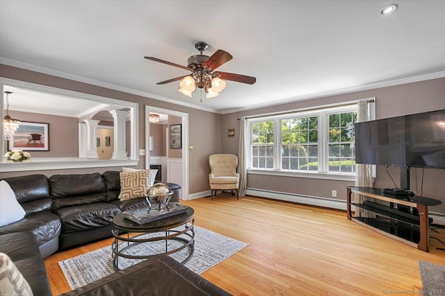 452 Burnt Plains Rd, Milford, CT 06461 - living room featuring decorative columns, a baseboard radiator, ceiling fan, crown molding, and wood finished floors