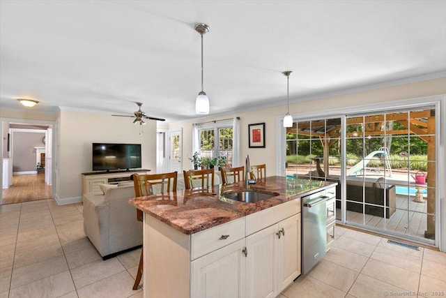 452 Burnt Plains Rd, Milford, CT 06461 - kitchen with a sink, stainless steel dishwasher, crown molding, light tile patterned floors, and dark stone counters