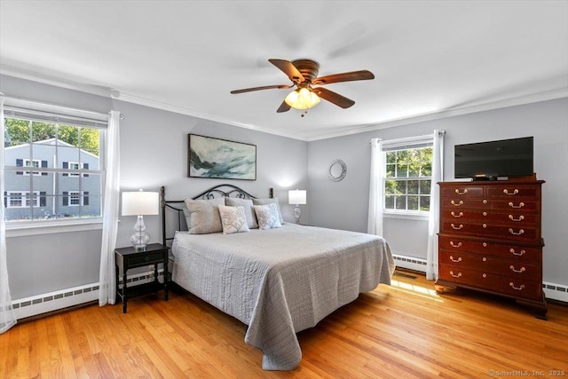 452 Burnt Plains Rd, Milford, CT 06461 - bedroom with a baseboard heating unit, multiple windows, light wood-type flooring, and ornamental molding