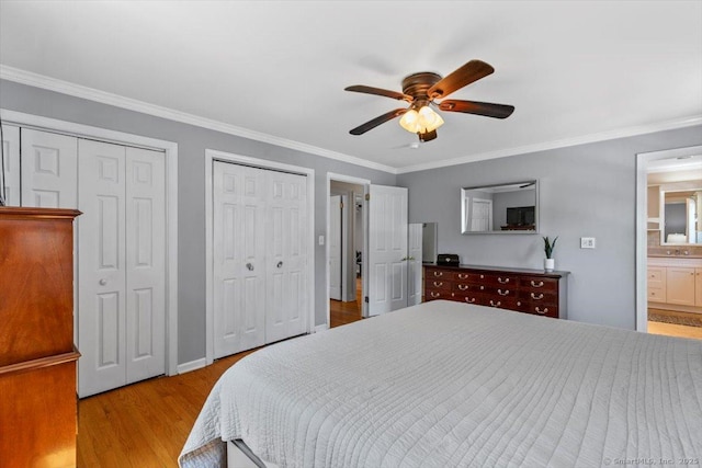 452 Burnt Plains Rd, Milford, CT 06461 - bedroom with two closets, wood finished floors, crown molding, connected bathroom, and ceiling fan