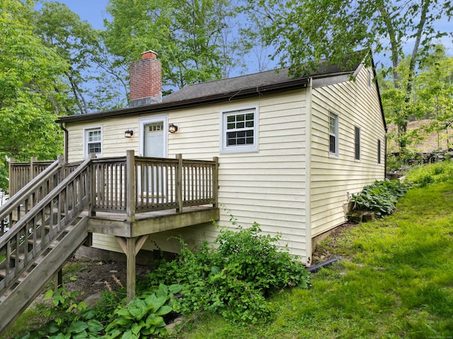 33 Lakewood Rd, East Hampton, CT 06424 - back of property featuring a deck, a chimney, and stairway