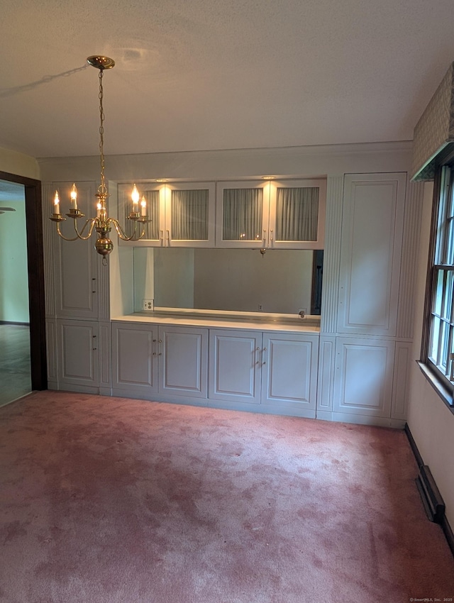 1060 Still Hill Rd, Hamden, CT 06518 - unfurnished dining area featuring a chandelier and carpet flooring