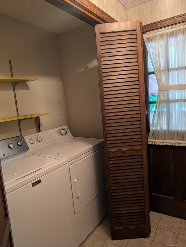 1060 Still Hill Rd, Hamden, CT 06518 - washroom with independent washer and dryer and light tile patterned floors
