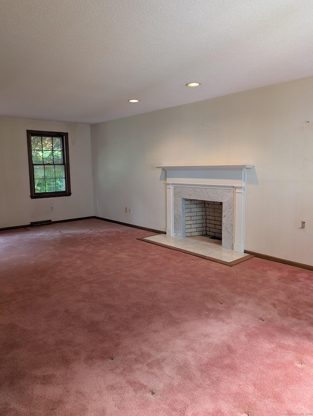 1060 Still Hill Rd, Hamden, CT 06518 - unfurnished living room featuring a fireplace, carpet floors, a textured ceiling, and recessed lighting