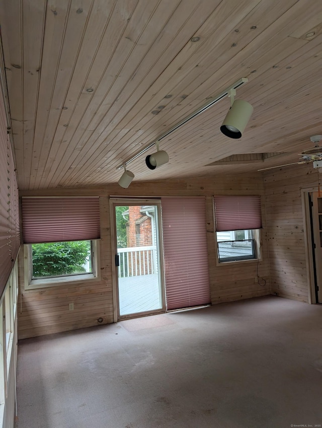 1060 Still Hill Rd, Hamden, CT 06518 - empty room featuring wood walls, healthy amount of natural light, wooden ceiling, carpet, and vaulted ceiling