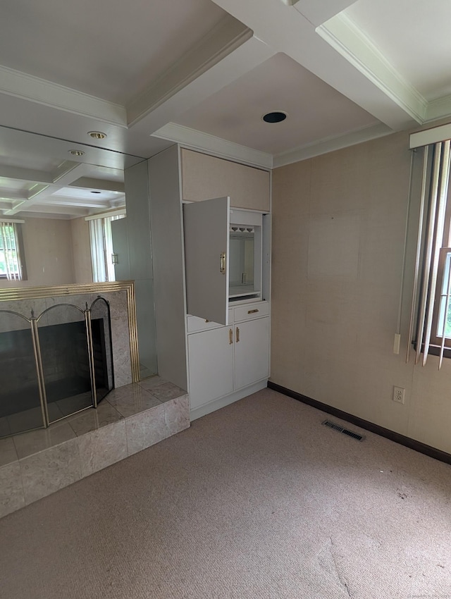 1060 Still Hill Rd, Hamden, CT 06518 - unfurnished living room with coffered ceiling, a fireplace, light carpet, ornamental molding, and beamed ceiling