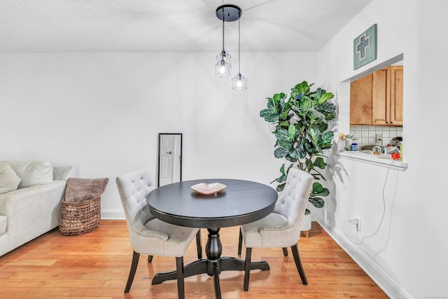 196 New Haven Ave Unit 322, Derby, CT 06418 - dining area featuring light wood finished floors and baseboards