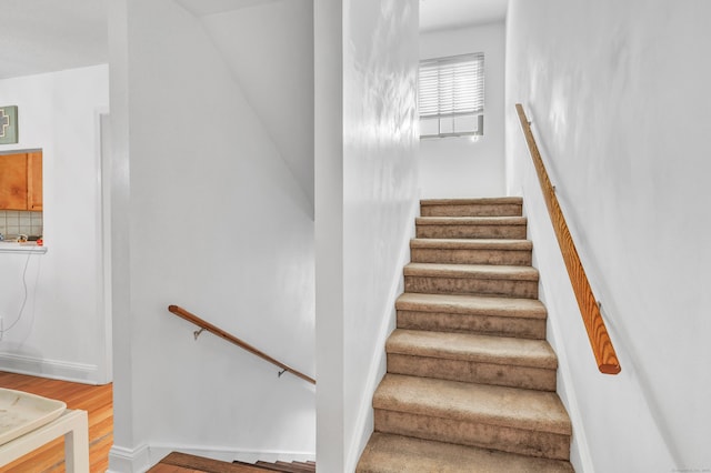 196 New Haven Ave Unit 322, Derby, CT 06418 - stairway with wood finished floors and baseboards