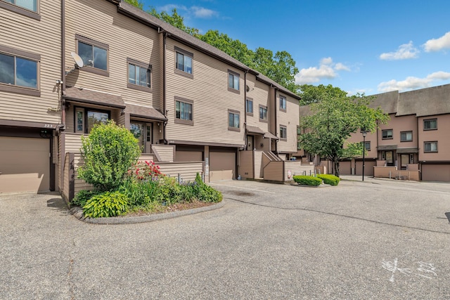 196 New Haven Ave Unit 322, Derby, CT 06418 - view of building exterior with a residential view and a garage