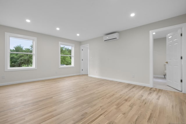 123 Lower Rd, North Canaan, CT 06024 - empty room featuring an AC wall unit, light wood finished floors, and recessed lighting