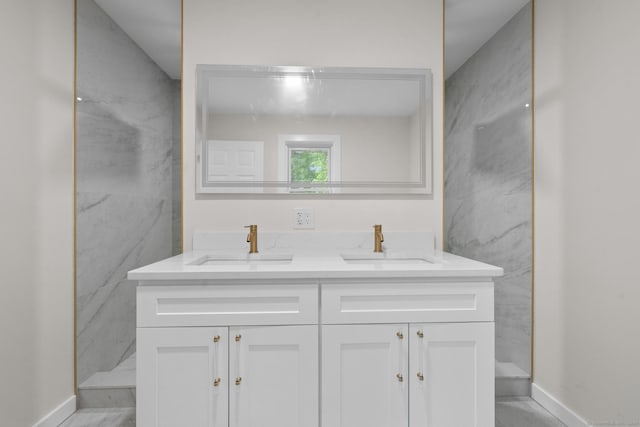 123 Lower Rd, North Canaan, CT 06024 - bathroom featuring double vanity and baseboards