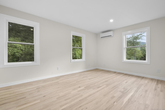 123 Lower Rd, North Canaan, CT 06024 - spare room with a wall unit AC, wood finished floors, plenty of natural light, and recessed lighting