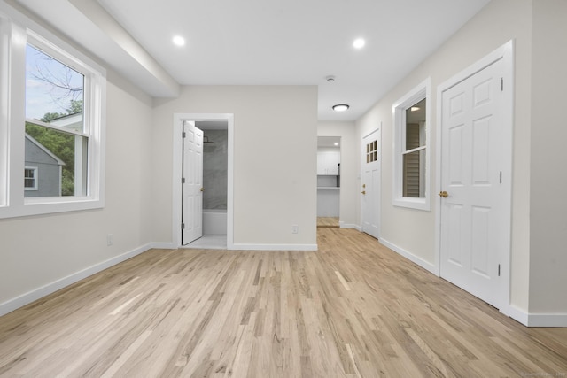 123 Lower Rd, North Canaan, CT 06024 - unfurnished bedroom featuring light wood-style floors, recessed lighting, connected bathroom, and a walk in closet