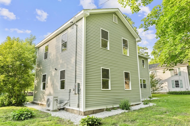 123 Lower Rd, North Canaan, CT 06024 - view of property exterior featuring a cooling unit and a lawn