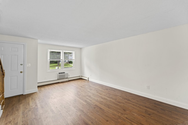 107 Greens Loop, Cheshire, CT 06410 - unfurnished living room with dark wood-style flooring, a wall mounted air conditioner, and a baseboard heating unit