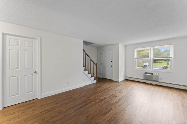 107 Greens Loop, Cheshire, CT 06410 - unfurnished living room with wood finished floors, stairs, and a textured ceiling