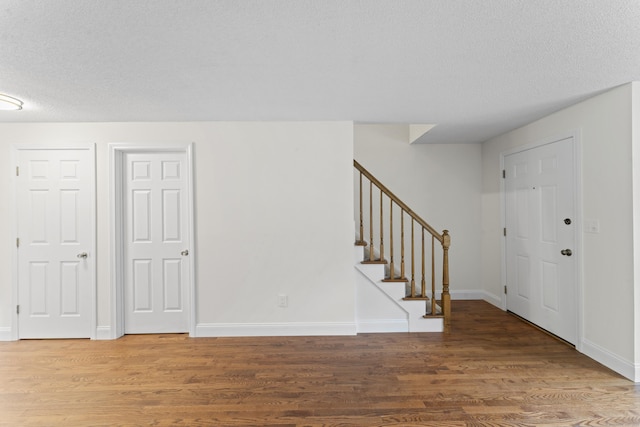 107 Greens Loop, Cheshire, CT 06410 - entryway with wood finished floors, a textured ceiling, and stairway