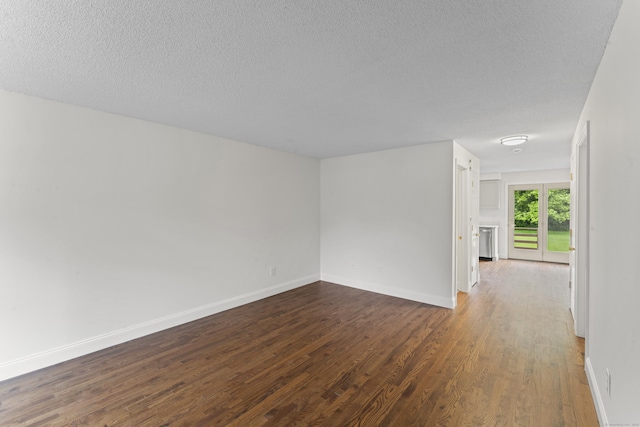107 Greens Loop, Cheshire, CT 06410 - unfurnished room featuring dark wood finished floors and a textured ceiling