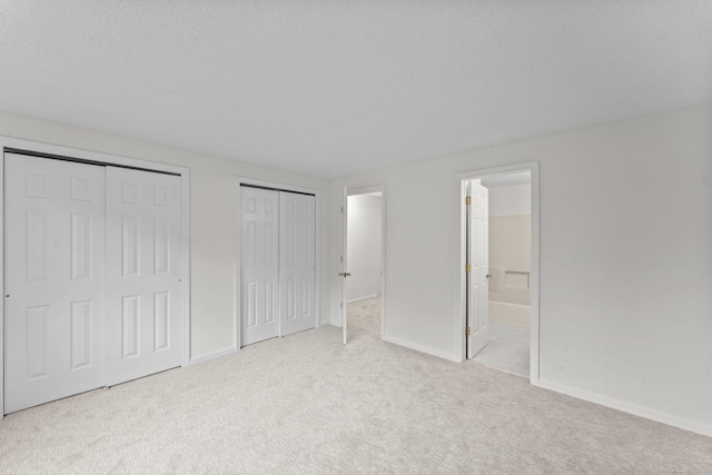 107 Greens Loop, Cheshire, CT 06410 - unfurnished bedroom with two closets, carpet, and ensuite bathroom