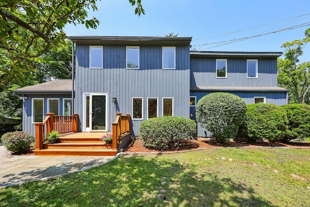 15 Grumman Ave, Norwalk, CT 06851 - view of front facade featuring a front lawn and a deck