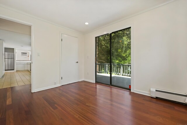 15 Grumman Ave, Norwalk, CT 06851 - empty room featuring wood finished floors, ornamental molding, a baseboard radiator, and recessed lighting