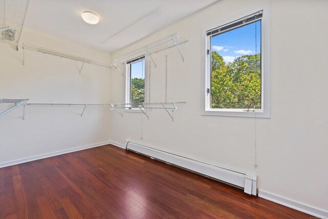 15 Grumman Ave, Norwalk, CT 06851 - walk in closet featuring a baseboard radiator and wood finished floors
