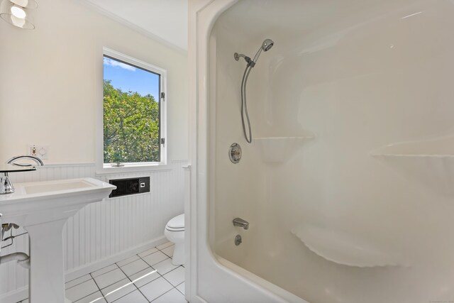 15 Grumman Ave, Norwalk, CT 06851 - bathroom featuring wainscoting, tile patterned flooring, and washtub / shower combination
