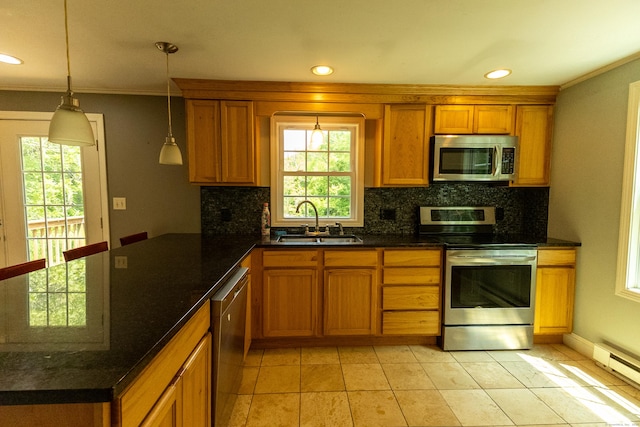 36 Harris Road Ext, Salem, CT 06420 - kitchen featuring appliances with stainless steel finishes, a sink, brown cabinets, a baseboard radiator, and backsplash
